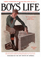 Boy on Trunk from the October 1913 Boys' Life cover